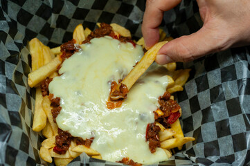 fries alone and with minced meat bolognese sauce mozzarella cheddar cheese and bacon 