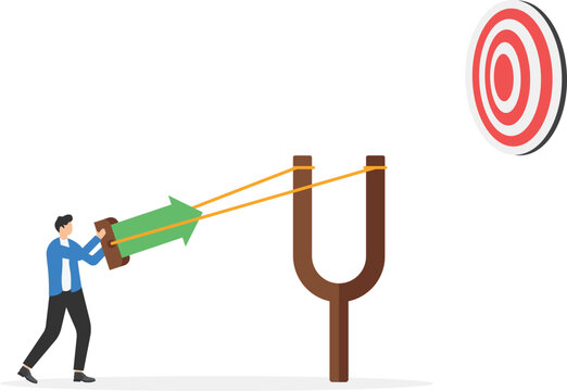 Businessman aiming high target with a big catapult, bullseye target to win in business strategy, Business target achievement and goal concept
