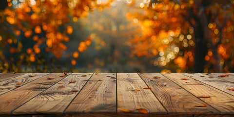 The empty wooden table top with blur background of autumn.