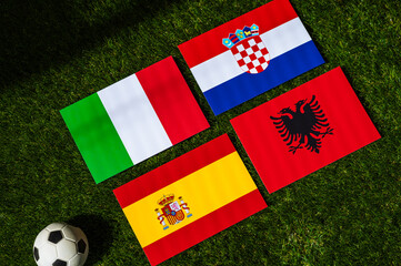 Spain Heads Group B: Flags of Spain, Croatia, Italy, Albania, and soccer ball on green grass at Europe football tournament in Germany in 2024 - obrazy, fototapety, plakaty