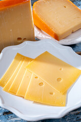 Cheese collection, Dutch ripe hard chees made from cow milk in the Netherlands in piece and sliced