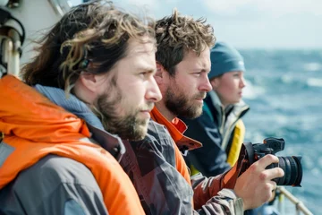 Fototapeten Oceanographers Capturing Sea Research on Camera at Sea © Ilia Nesolenyi