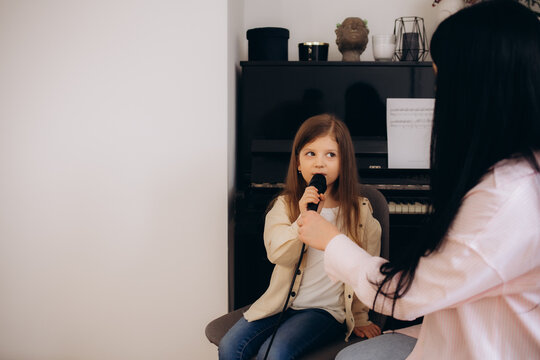 little girl at singing lessons