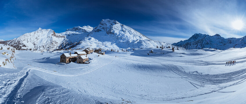 The Simplon Pass, snowy with the peaks of the Lepontine Alps and the small village of "Hopsce", near the town of Simplon, Switzerland