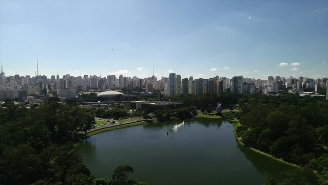Aerial view of Ibirapuera Park - Parque Ibirapuera, Sao Paulo, Brazil. Landmark avenue and buildings of city. Ibirapuera lake. This image is perfect for projects related to events, travel and tourism.