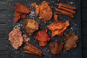 Mix of dried meat Jerky . From chicken , beef and pork.