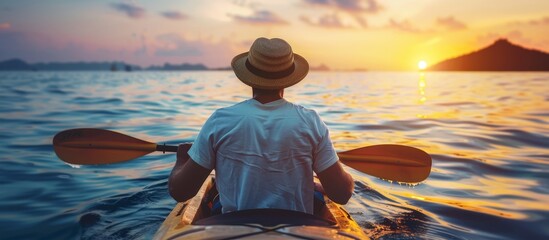 Solo male adventurer kayaking at sunset in pristine blue waters, serene summer seascape