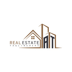 AT initial monogram logo for real estate with home shape creative design.