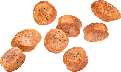 Falling fried sausage slices isolated