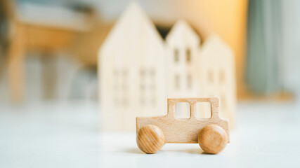 Car and house model in wood table, concepts of contract to buy, get insurance or loan real estate or property background.	