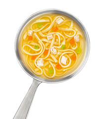 Instant chicken noodle soup in ladle isolated on white background, top view