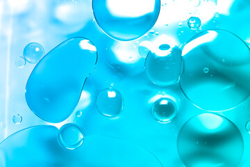 Oil drop background on blue water surface It is natural and abstract.