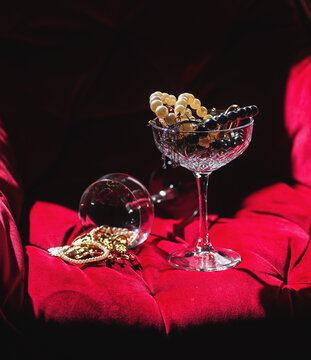 Beads from pearls in a wine glasses . jewelry in a wine glass