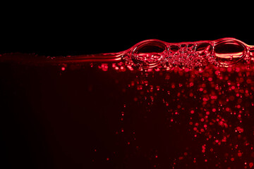 Red wine on a black background, abstract splashing. - 787408151