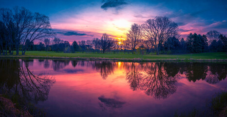 Tranquil spring forest pond sunrise panoramic landscape in Madison, Wisconsin, USA