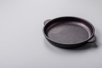 An empty plate on a gray concrete background with copy space