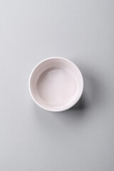 An empty plate on a gray concrete background with copy space