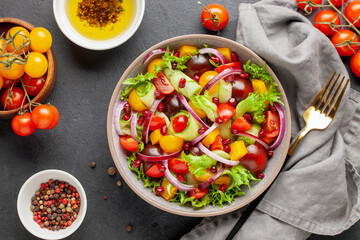 Easy vegetarian salad of fresh cucumber, tomato, sweet pepper,  onion  with pomegranate seeds....