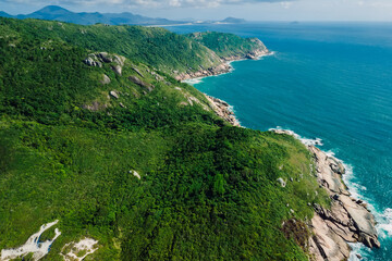 Coastline with mountains and blue ocean. Aerial view with mountains and ocean with waves - 787411964
