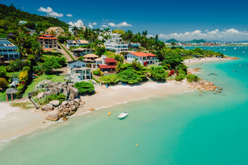 Tropical beach with luxury villas and turquoise ocean in Brazil. Aerial view