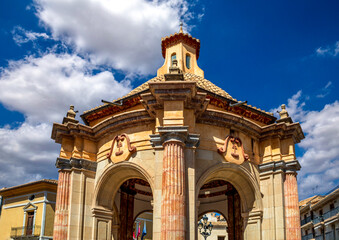 Detailed view of the circular temple with baroque columns in Caravaca, Murcia, Spain with blue sky and clouds