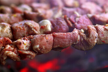 Coocking meat for outdoor barbecue. Close up meat barbecue on a charcoal grill. Cooking barbecue on charcoal.