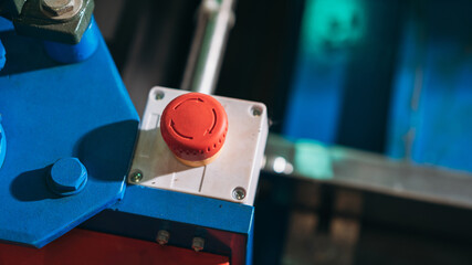 A red button on a blue box