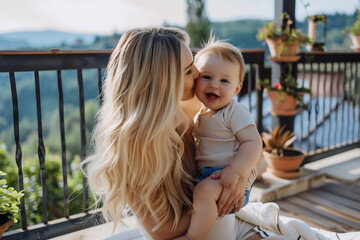 Fototapeta premium Mother and child on vacation. Mom hugs and kisses the child