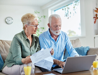 woman man senior bill finance retirement couple home document laptop wife computer budget elderly...