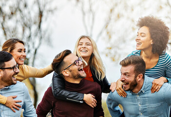 fun woman young man friendship group happy happiness piggyback friend outdoor lifestyle together smiling cheerful togetherness girl laughing vacation joy youth carefree, beautiful student - obrazy, fototapety, plakaty