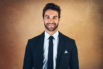 Smile, portrait and man for corporate fashion with clothes, style and formal wear isolated on brown...