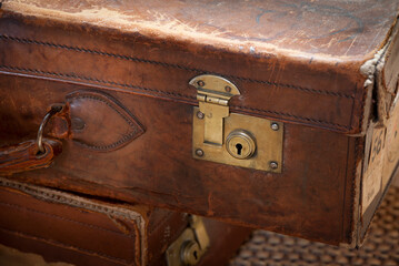 Old leather suitcase with brass lock