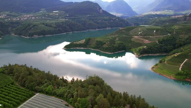  beautiful lakes of northern Italy. scenic Cles castel- in Trentino , province of Trento. lake Santa Giustina. Val di Non apple valley. aerial drone view
