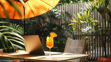 A workspace transformed into a relaxation zone with a cocktail glass next to the laptop, an umbrella shading the scene, depicting the new remote work lifestyle - obrazy, fototapety, plakaty