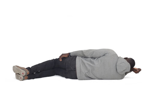 back view oa a man lying on the floor on white background