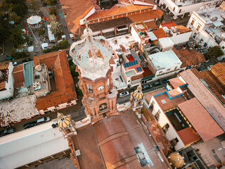 High angle top top down view of our Lady of Guadalupe church in Puerto Vallarta, Mexico at sunset.