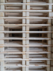 wooden pallets for transport stacked on top of each other
