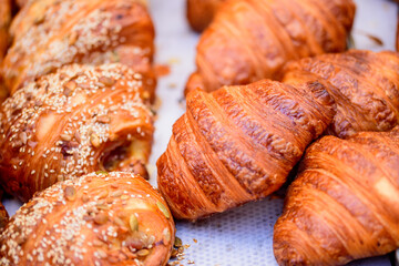 buttery croissants and sweet croissants sprinkled with sesame seeds and pumpkin seeds