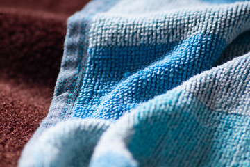 Crumpled blue towel close-up. Natural cotton fibers for clothing and knitwear