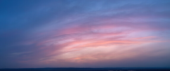 Ideal for Sky replacement project: Large Panoramic, pastel pink-orange-blue evening sky after...