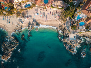 Horizontal aerial view of Conchas Chinas Beach in Mexico showing clear turquoise water in ocean - obrazy, fototapety, plakaty