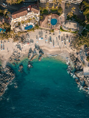 Vertical aerial view of Conchas Chinas Beach in PV Mexico showing clear turquoise water in ocean - obrazy, fototapety, plakaty