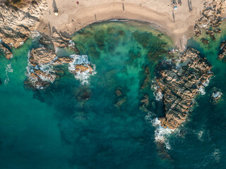 Horizontal aerial view of Conchas Chinas Beach in Puerto Vallarta. Bright clear turquoise water at...