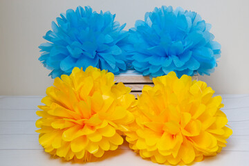 blue and yellow paper pompoms