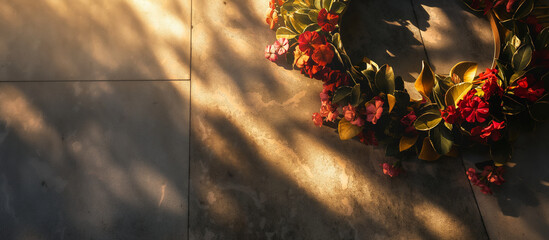 A ceremonial wreath being laid at a war memorial, with soft light casting a solemn shadow to symbolize honor and remembrance. Memorial Day, Independence Day , with copy space