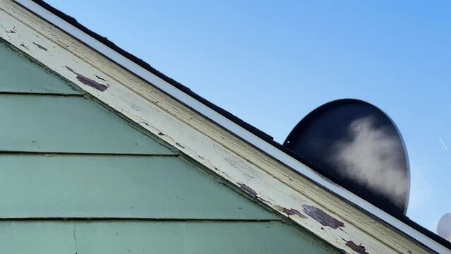 Power washing house siding close up in slow motion