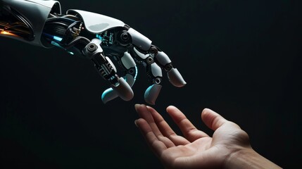 Human hand reaching out towards robotic hand