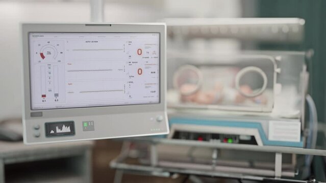 Lung Ventilation Clinic Equipment performs tests on vital breathing health signs. Testing the vitals of a sick child at the clinic. Test monitor displays a decline of patient vitals at a clinic.
