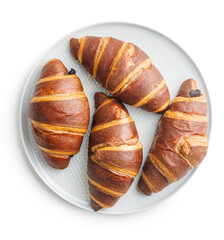Freshly Baked Chocolate Croissants on plate Isolated Against White Background - 787469374