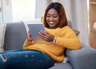 Tablet, ebook and happy black woman on sofa with social media, reading or website scroll at home. Digital, research or student with streaming app for sign up, online course or elearning registration